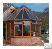 uPVC wood effect conservatory with dwarf wall