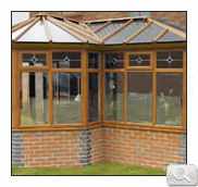 Wood effect bespoke P shaped conservatory